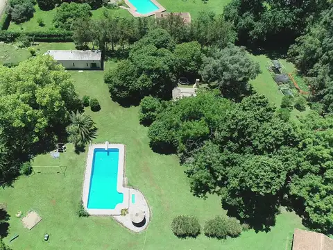 CASA LOTE 11.993 M2. CASA PRINCIPAL Y HUESPEDES - QUINCHO - TALLER - EXCELENTE FORESTACION - LOBOS -