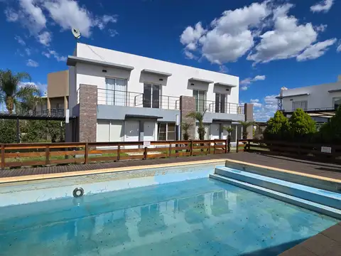 DUPLEX CON PILETA, US$60.000 A 800 METROS DE TERMAS AMOBLADO