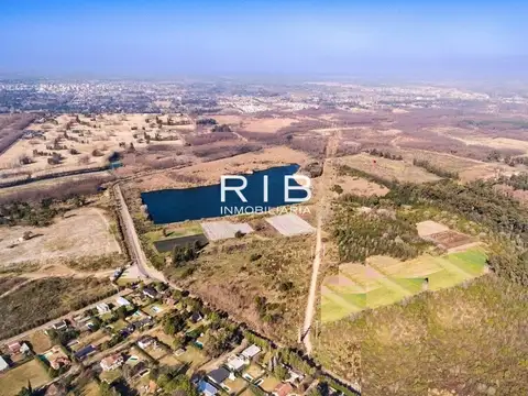 Campo de 52ha con laguna de 11ha cerca del Parque Industrial Pilar