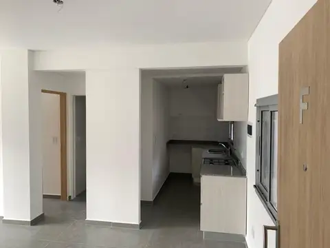 DEPARTAMENTO DE 2 AMBIENTES CON COCHERA DESCUBIERTA