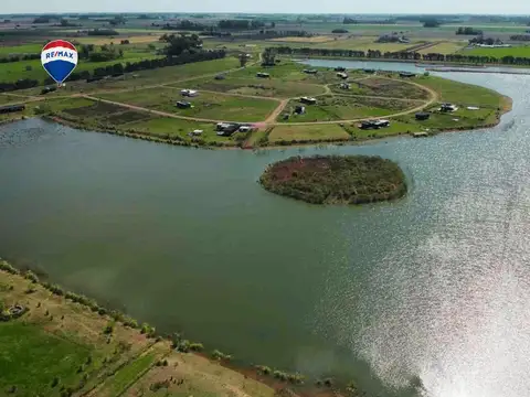 LOTE DE 2.067 M2 CON MEJORAS Y CERCANO A LA LAGUNA