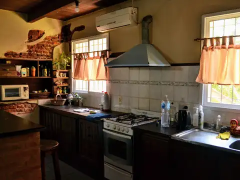 Terreno con 3 departamentos y local en Funes Av. Rosario 1700